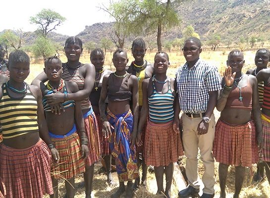 Moses and local community in Uganda inspiring student