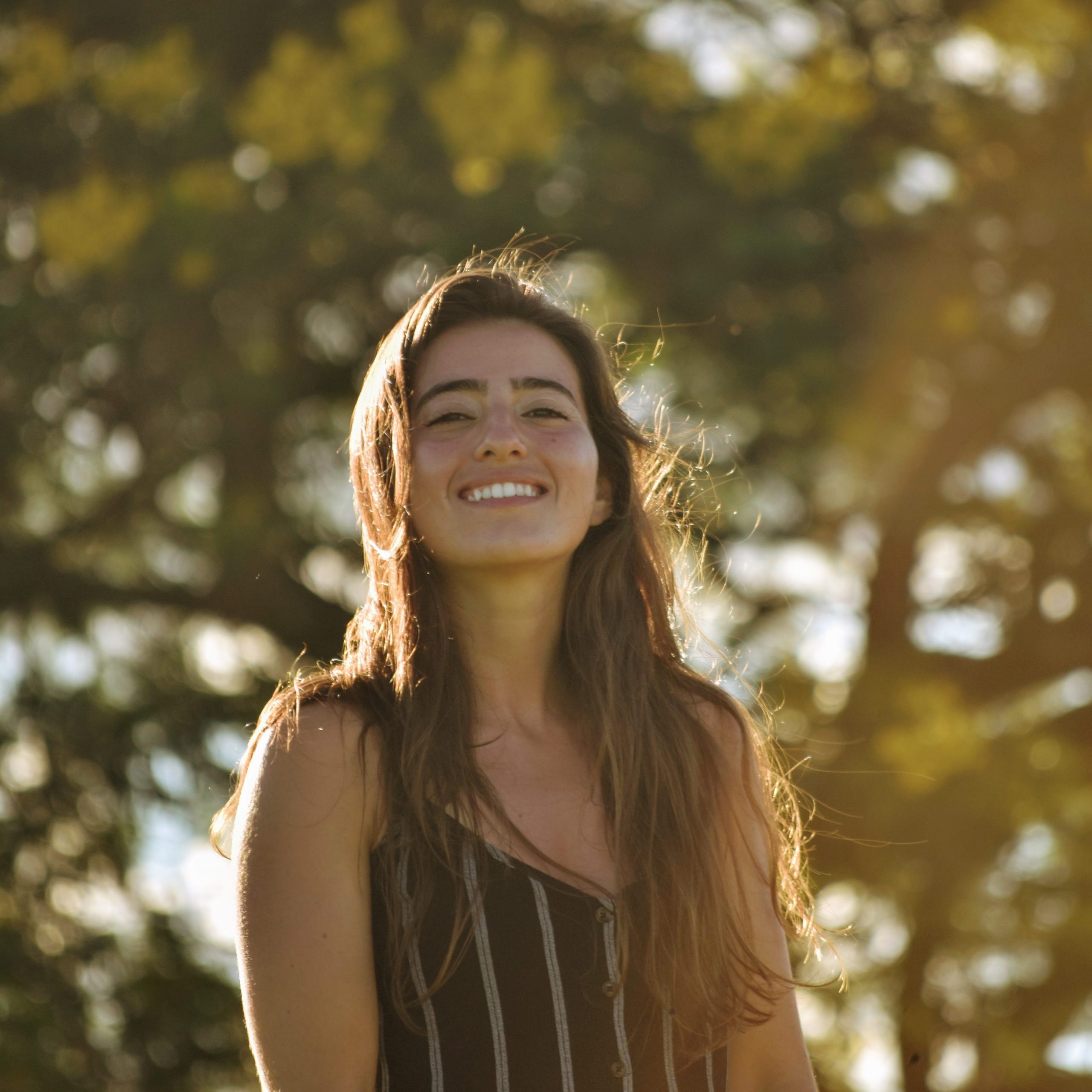 Photo of Dr Gaspar Quinonez smiling in a forest