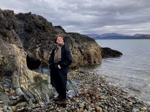 Photo of Ellis Fannin standing by the sea.