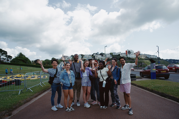 A group of young people smiling and happy.