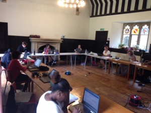 Photo of people writing (socially distanced) at The Abbey