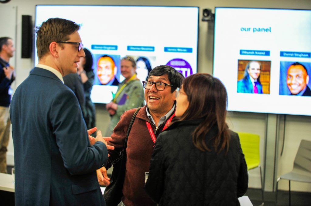 Colleagues networking during the conference.