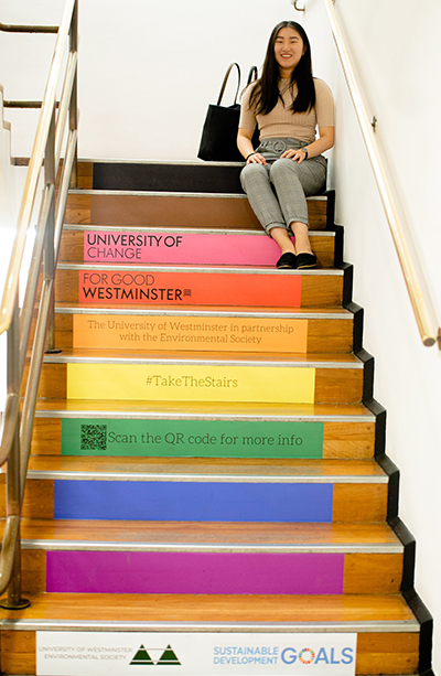 How to Be Sustainable as a Student: Part 1 - International Student Blogger, Grace Lee - Grace on the Cavendish stairs with Environmental Society messages