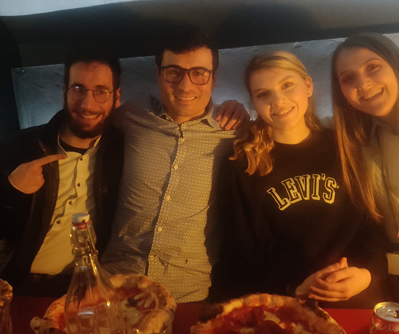 International Student Blogger-Dennis Montagano-Dennis with classmates and teacher eating in a pizzeria