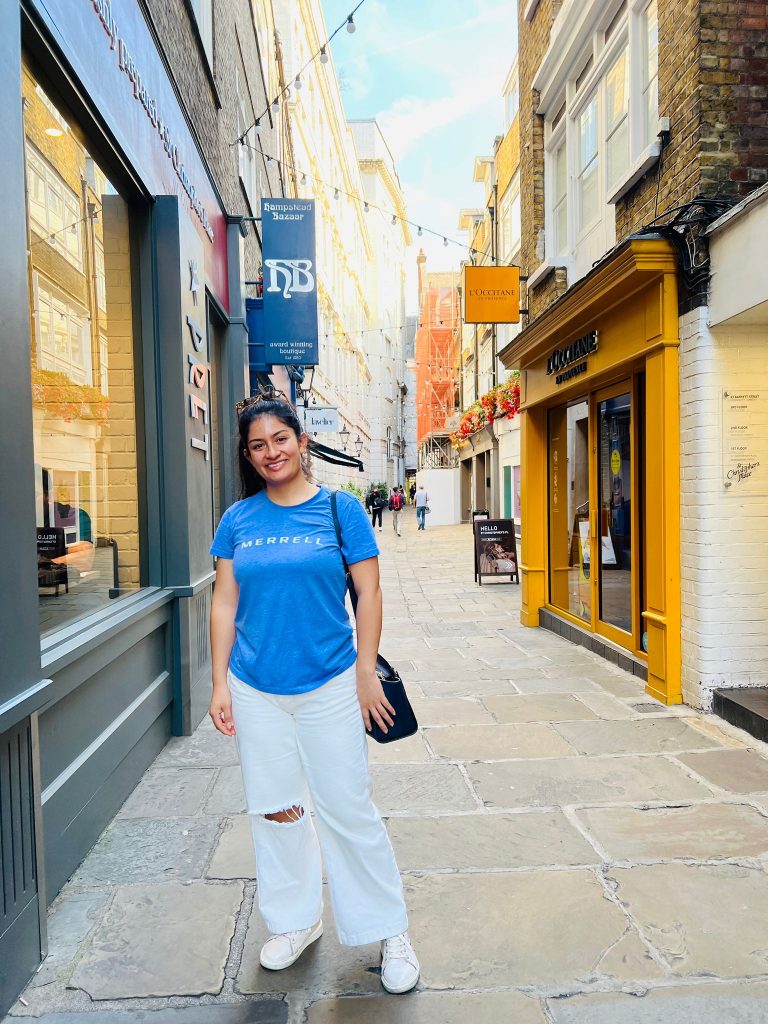 Lorena Alvarez Riveros outside shops in London alley