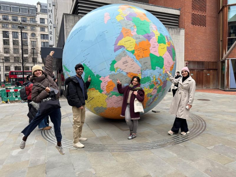 International student group with large outdoor globe in London-London Adventure