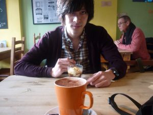 Image of Toshiki in a café during his study abroad.