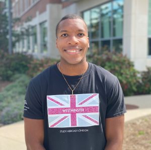 Image of Michael at his home university’s campus still rocking his University of Westminster shirt.