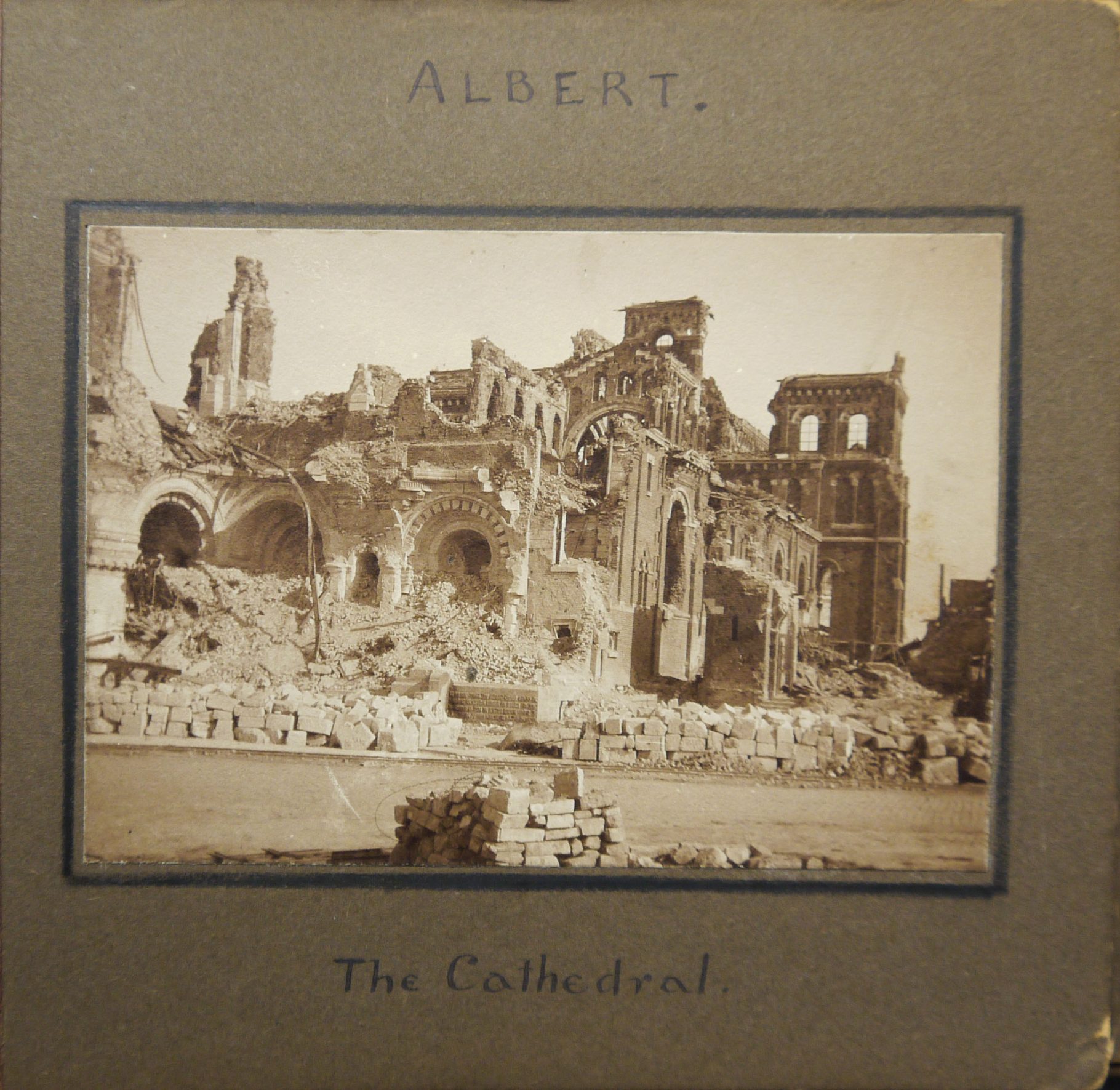 Photograph of the cathedral in Albert, France after it has been heavily bombed. Taken from an album