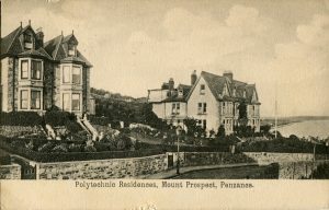 black and white photo of 2 large houses