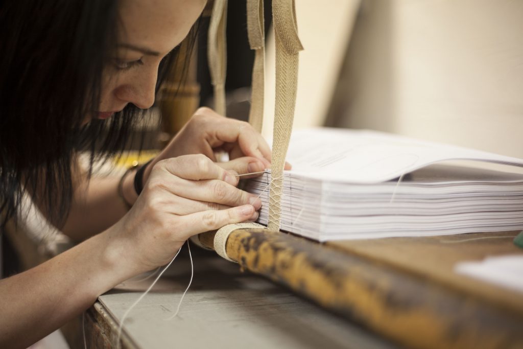 Intricate business: Hayley finishes a project carefully by hand. Her seven-month course has seen her become a fully-qualified bookbinder, aged 29 | (Barnard & Westwood)