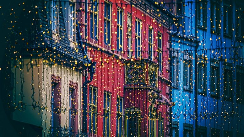 Fairy lights over colourful houses