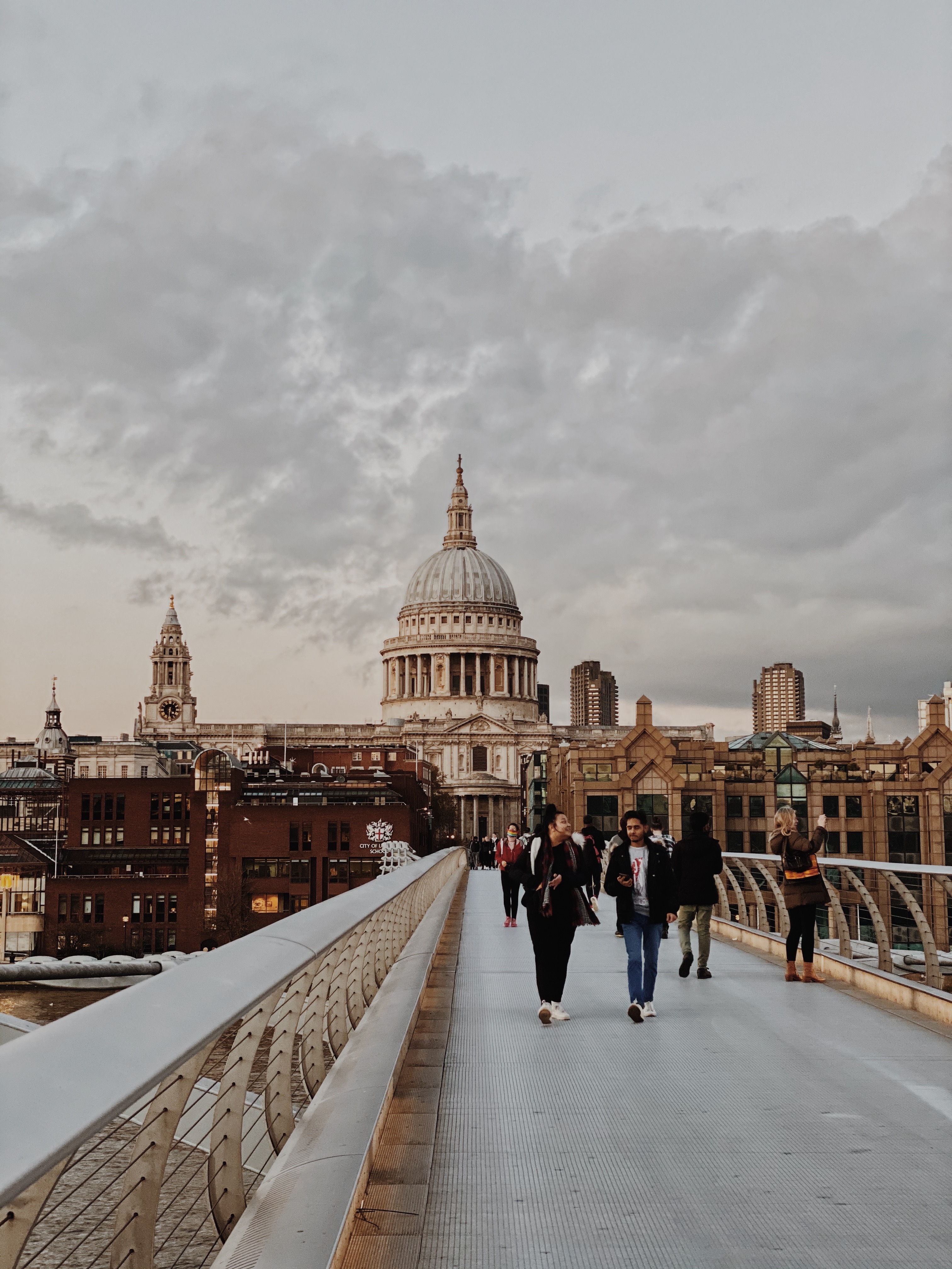 London St Pauls people crossing bridge