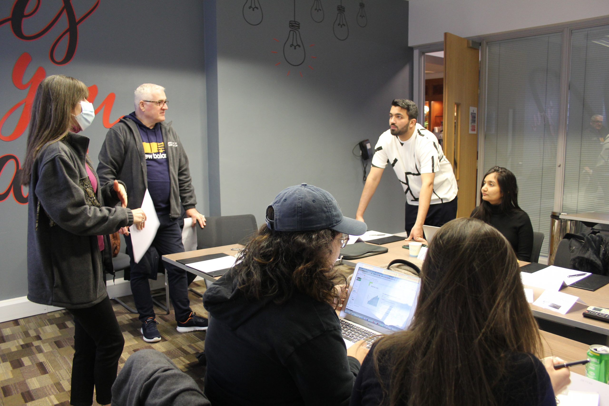 Marketing Residential group work in meeting room with students and lecturers