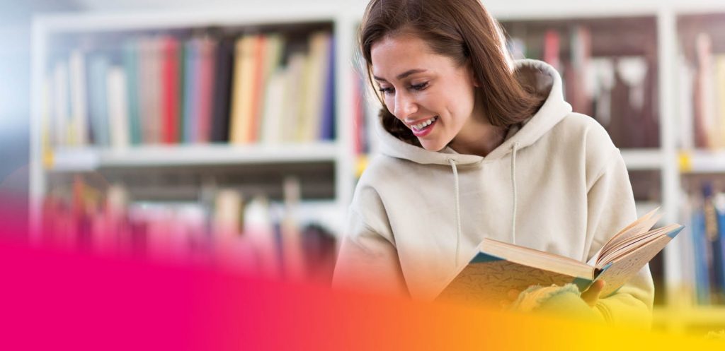 Smiling woman holding a book