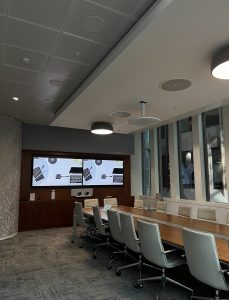 Meeting room with large table and tv