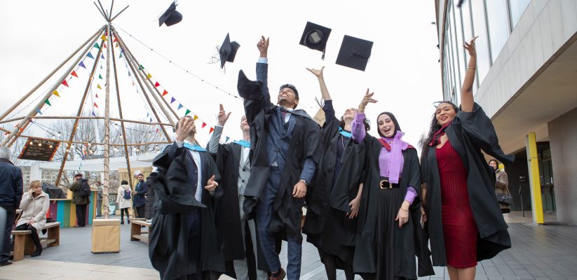 Graduating students throw their hats outside Royal Festival Hall