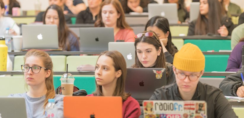 group of students sitting in a lecture theatre