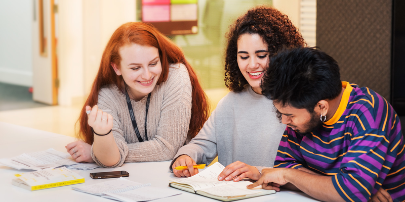 Three students revising together at university