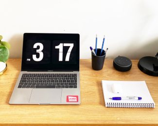 Desk with a laptop and stationary