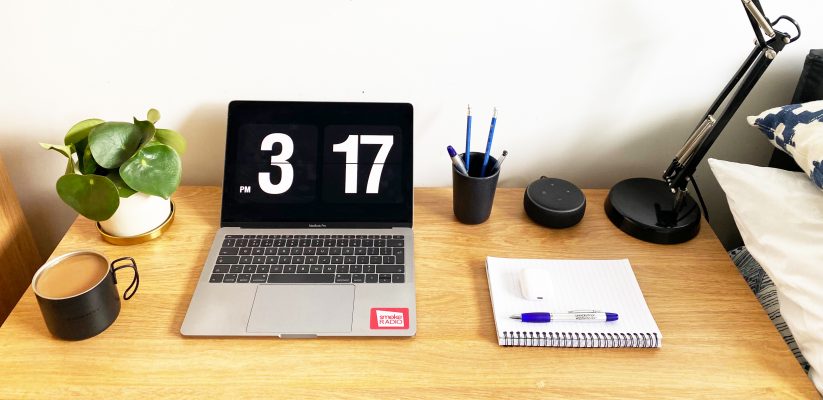 Desk with a laptop and stationary