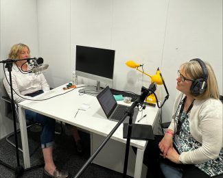 Professor Coral Dando and Professor Catherine Loveday recording their episode of Psychology Unleashed in a studio.