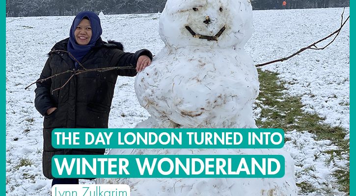 The Day London Turned into Winter Wonderland_International Student Blogger_Lynn Zulkarim_Lynn leaning against a snowman