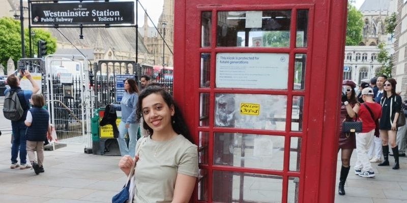Yasi outside Westminster red phonebooth-London Adventure