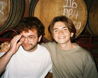 Living by Yourself in London: Finding Comfort in Metropolitan Chaos-Bernado smiling with friend in beer cellar-International Student Blog-Bernado Arton