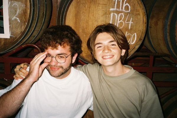 Living by Yourself in London: Finding Comfort in Metropolitan Chaos-Bernado smiling with friend in beer cellar-International Student Blog-Bernado Arton