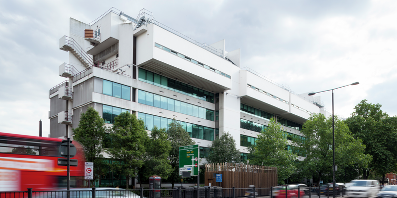 University of Westminster, Marylebone Campus, 35 Marylebone Rd. General view of the building, taken from across the street, view from an angle, cars and London red bus in foreground