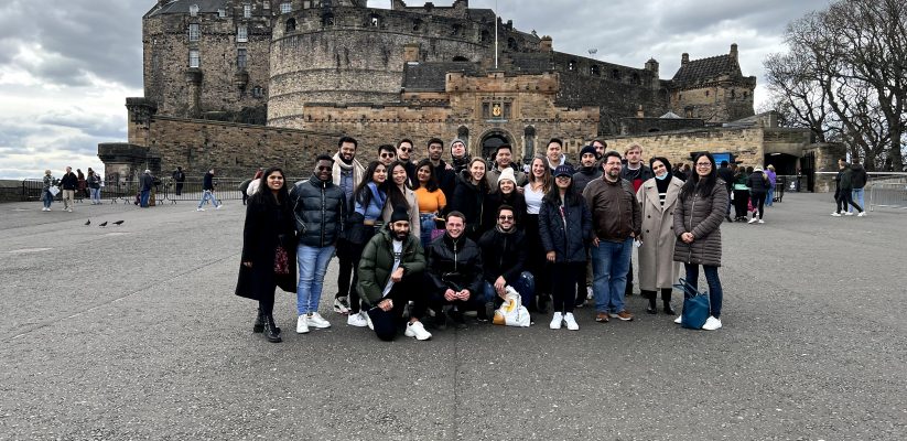 Group photo with Entrepreneurship students and staff with Edinburgh Castle in the background grey overcast sky